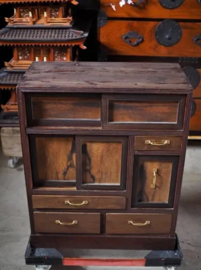 A small antique tea cabinet made entirely of solid black persimmon boards from the early Showa period.