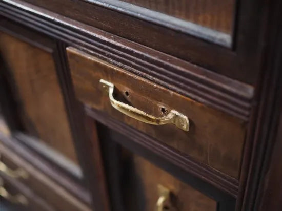 A small antique tea cabinet made entirely of solid black persimmon boards from the early Showa period.