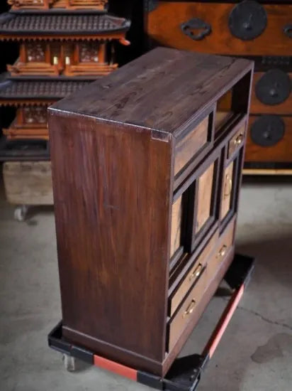 A small antique tea cabinet made entirely of solid black persimmon boards from the early Showa period.