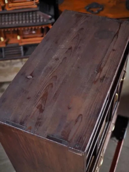 A small antique tea cabinet made entirely of solid black persimmon boards from the early Showa period.