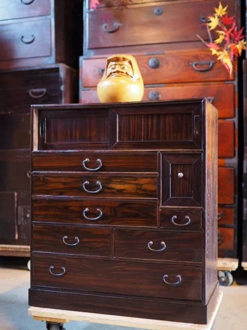 A small, heavy-duty drawer made of black persimmon wood from the early Showa period