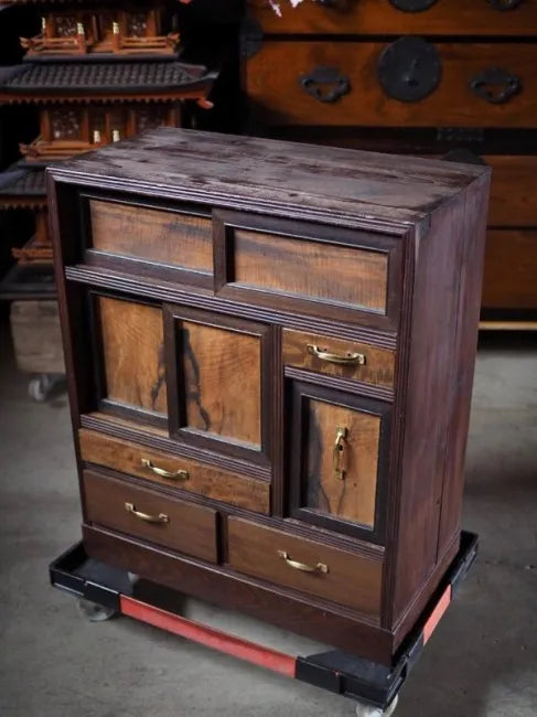 A small antique tea cabinet made entirely of solid black persimmon boards from the early Showa period.